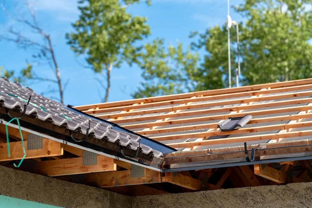 Construction beginning on rooftop of new family home.