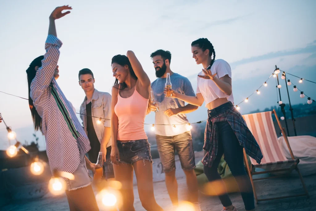 carefree-group-of-happy-friends-enjoying-party on walkdeck